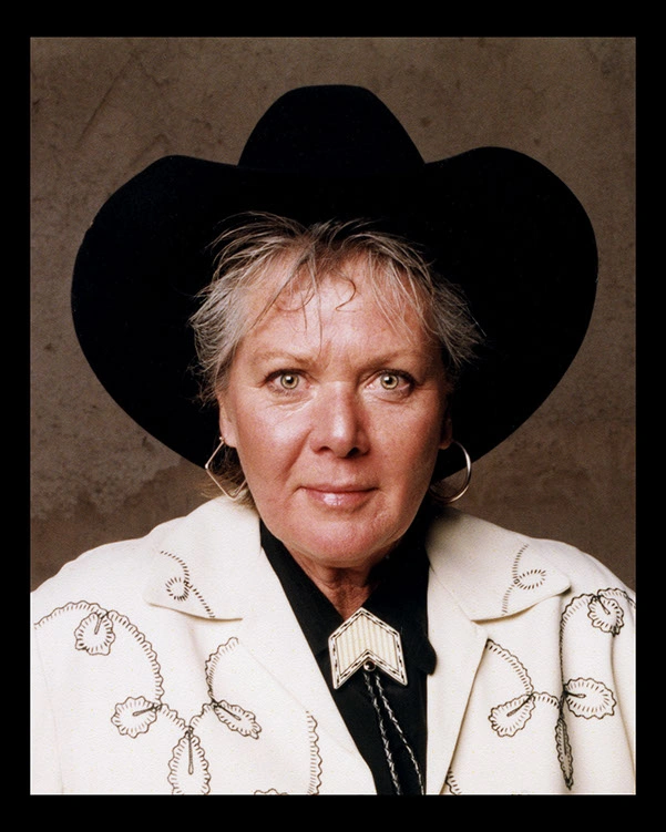 Alice Joanne Stevens wearing a black cowboy hat and embroidered light jacket